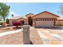 Charming single-story home with a well-manicured front yard and inviting curb appeal at 4010 N 156Th Ln, Goodyear, AZ 85395