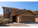 Two-story home featuring a two-car garage and landscaped front yard at 4659 E Pinto Valley Rd, San Tan Valley, AZ 85143