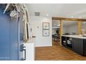 Inviting entryway leads to an open floor plan with hardwood floors and a modern interior design at 4907 E Piccadilly Rd, Phoenix, AZ 85018