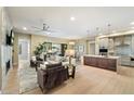 Spacious living room with views of the patio, seamlessly connected to the kitchen and dining area at 5250 E Deer Valley Dr # 206, Phoenix, AZ 85054