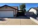 Spacious driveway leading to a two-car garage, and side gate at 637 E Kramer St, Mesa, AZ 85203