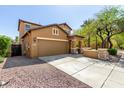 Charming two-story home featuring a two-car garage, inviting front porch, and low maintenance desert landscaping at 7359 W Kings Ave, Peoria, AZ 85382
