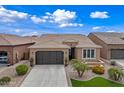 Attractive single-Gathering home featuring a two-car garage and tidy landscaping at 77 E Atole Ct, Queen Creek, AZ 85140