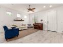 Cozy living room features a piano and neutral furniture at 8336 E Idaho Ave, Mesa, AZ 85209