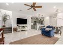 Open floor plan with modern furniture and tile flooring at 8336 E Idaho Ave, Mesa, AZ 85209
