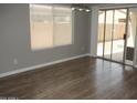 Well-lit dining area with sliding glass doors that brings in natural light and offers backyard access at 10028 E Kilarea Ave, Mesa, AZ 85209