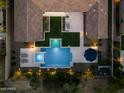 A bird's eye view of an amazing backyard with a beautiful pool and built in grill at 10778 N 137Th St, Scottsdale, AZ 85259
