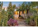 Charming home with desert landscaping featuring cacti and flowering shrubs at 1345 W 14Th St, Tempe, AZ 85281