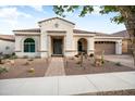 Welcoming single-story home with desert landscaping, a tile roof, and inviting entrance at 20977 W Mariposa St, Buckeye, AZ 85396