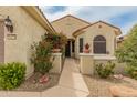 Inviting home exterior with a landscaped walkway leading to the front door at 26473 W Runion Ln, Buckeye, AZ 85396