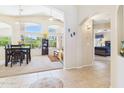 Dining area with large windows, adjacent to the living space, creating an open layout at 28942 N Lazurite Way, San Tan Valley, AZ 85143