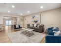 Bright and airy living room featuring modern furnishings and neutral color palette at 3209 E Marilyn Rd, Phoenix, AZ 85032