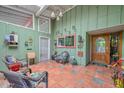 Inviting covered entryway with colorful decor, tiled floor, and comfortable seating at 3328 S Stanley Pl, Tempe, AZ 85282