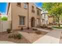 Inviting two-story home featuring a neutral exterior, manicured landscaping, and a welcoming walkway at 3591 S Ranger Trl, Gilbert, AZ 85297