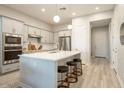 Modern kitchen featuring stainless steel appliances, a center island, and sleek cabinetry at 3918 E Arabian Dr, Gilbert, AZ 85296