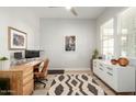 Bright home office featuring a large window, modern desk, and elegant decor at 3918 E Arabian Dr, Gilbert, AZ 85296