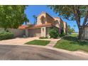 Charming two-story home featuring a well-manicured lawn and attached two-car garage at 4020 E Laurel Ln, Phoenix, AZ 85028