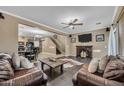 Spacious living room offering hardwood floors, a fireplace and ample room for entertaining at 41369 W Parkhill Dr, Maricopa, AZ 85138