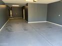 This garage features painted walls and an epoxy floor at 4253 E Palo Verde St, Gilbert, AZ 85296