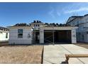 New home construction with exposed roof tile and lumber awaiting siding and finishing work at 7433 W Buckhorn Trl, Peoria, AZ 85383