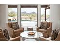 Serene living room showcases desert views, comfortable seating, and stylish decor at 8400 E Dixileta Dr # 153, Scottsdale, AZ 85266