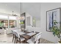 Bright dining area with stylish chandelier and easy access to the living room at 8989 N Gainey Center Dr # 231, Scottsdale, AZ 85258
