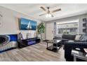 Bright living area with wood-look flooring, stylish decor, and plenty of natural light at 903 N Revere St # F, Mesa, AZ 85201