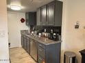 Clean kitchen featuring granite countertops and stainless steel appliances with ample cabinetry at 948 S Alma School Rd # 115, Mesa, AZ 85210