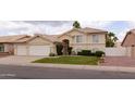 Charming two-story home featuring a well-manicured lawn and a spacious two-car garage at 1150 E Tyson St, Chandler, AZ 85225