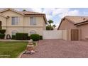 Well-maintained side yard with lush greenery and gravel area at 1150 E Tyson St, Chandler, AZ 85225