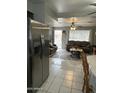 Comfortable living room with tile floors, ceiling fans, and lots of natural light at 1740 W Crescent Ave, Mesa, AZ 85202