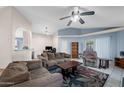 Spacious living room features tile floors, large windows, vaulted ceilings, and comfortable seating area at 1836 N Stapley Dr # 4, Mesa, AZ 85203