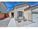 Beautiful home with a cozy entrance featuring comfortable seating and an inviting front walkway at 20338 N 262Nd Ave, Buckeye, AZ 85396