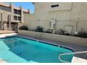 Community pool with crystal clear water and privacy fence at 225 N Pomeroy -- # 16, Mesa, AZ 85201