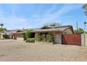 Charming home with solar panels, showcasing sustainability and a well-maintained front yard at 3830 E Desert Cove Ave, Phoenix, AZ 85028