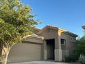 Charming single-story home featuring a well-maintained yard and attached two-car garage at 4031 E Barwick Dr, Cave Creek, AZ 85331