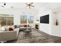 Bright living room with vaulted ceilings, fireplace, and sliding doors to the outdoor living space at 4031 E Barwick Dr, Cave Creek, AZ 85331