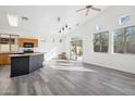 Open-concept living area featuring vaulted ceilings, recessed lights, and luxury vinyl flooring at 4031 E Barwick Dr, Cave Creek, AZ 85331