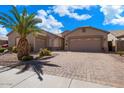 Spacious driveway leading to a well-maintained home with a tandem garage, offering ample parking at 43261 W Neely Dr, Maricopa, AZ 85138