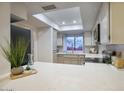Bright and airy kitchen with stainless steel appliances, white cabinetry, and a large window above the sink at 614 W Kings Ave, Phoenix, AZ 85023