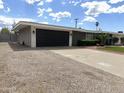 View of home with a spacious driveway and well-maintained exterior at 6207 W Orange Dr, Glendale, AZ 85301