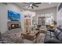 Beautiful living room featuring a fireplace, modern decor, and an open floor plan at 6703 E Soaring Eagle Way, Scottsdale, AZ 85266