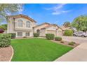Attractive home featuring a lush green lawn, tile roof, and well-maintained landscaping at 844 E San Remo Ave, Gilbert, AZ 85234