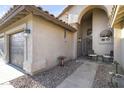 Inviting covered front porch with chairs, offering a relaxing outdoor space at 9954 W Mohawk Ln, Peoria, AZ 85382
