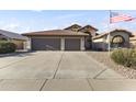 Driveway leads to a spacious two-car garage, perfect for parking and storage at 9954 W Mohawk Ln, Peoria, AZ 85382