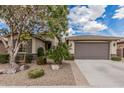 Charming single-story home features desert landscaping and a spacious two-car garage at 1078 W Redwood Ave, Queen Creek, AZ 85140