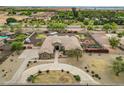 Large single-Gathering home with circular driveway, extensive landscaping, pool and patio in a serene setting at 14539 W Becker Ln, Surprise, AZ 85379