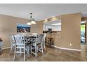 Comfortable dining area situated next to the kitchen and featuring modern lighting at 16739 E El Lago Blvd # 103, Fountain Hills, AZ 85268