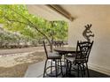 Cozy patio area with a table and chairs, perfect for enjoying the outdoors at 16739 E El Lago Blvd # 103, Fountain Hills, AZ 85268