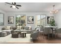 Bright living room with a ceiling fan, natural light and modern furniture at 18250 N Cave Creek Rd # 147, Phoenix, AZ 85032